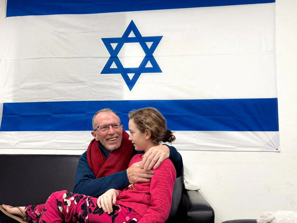 FILE PHOTO: Hostages released by Palestinian Islamist group Hamas meet family