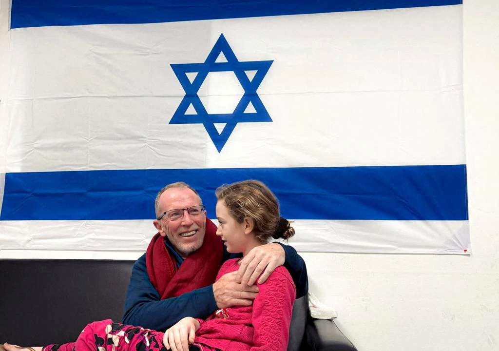 FILE PHOTO: Hostages released by Palestinian Islamist group Hamas meet family
