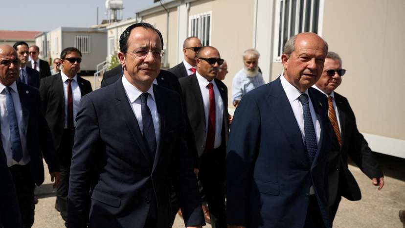 FILE PHOTO: Cyprus President Nikos Christodoulides and Turkish Cypriot leader Ersin Tatar, walk during a visit at the the CMP Anthropological Laboratory in the buffer zone of Nicosia airport