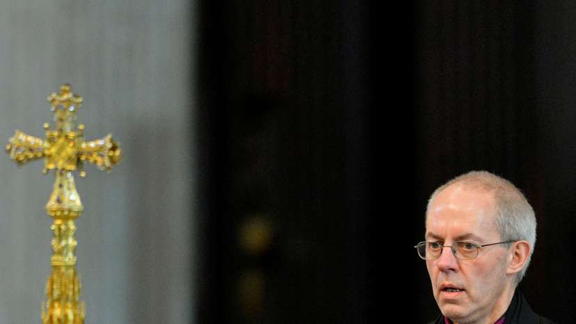 FILE PHOTO: File photograph shows Justin Welby, the new Archbishop of Canterbury, leaving at the close of the ceremony to confirm his election as Archbishop, at St Paul's Cathedral in London