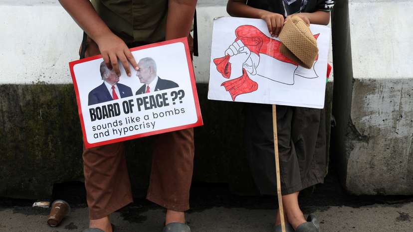 Boys in solidarity with Palestinians take part in a protest outside the U.S. embassy in Jakarta