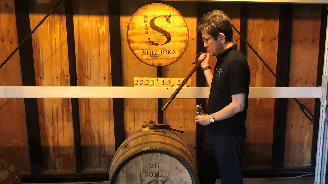 Taiko Nakamura samples whisky barreled in the year he founded at his distillery in Shizuoka