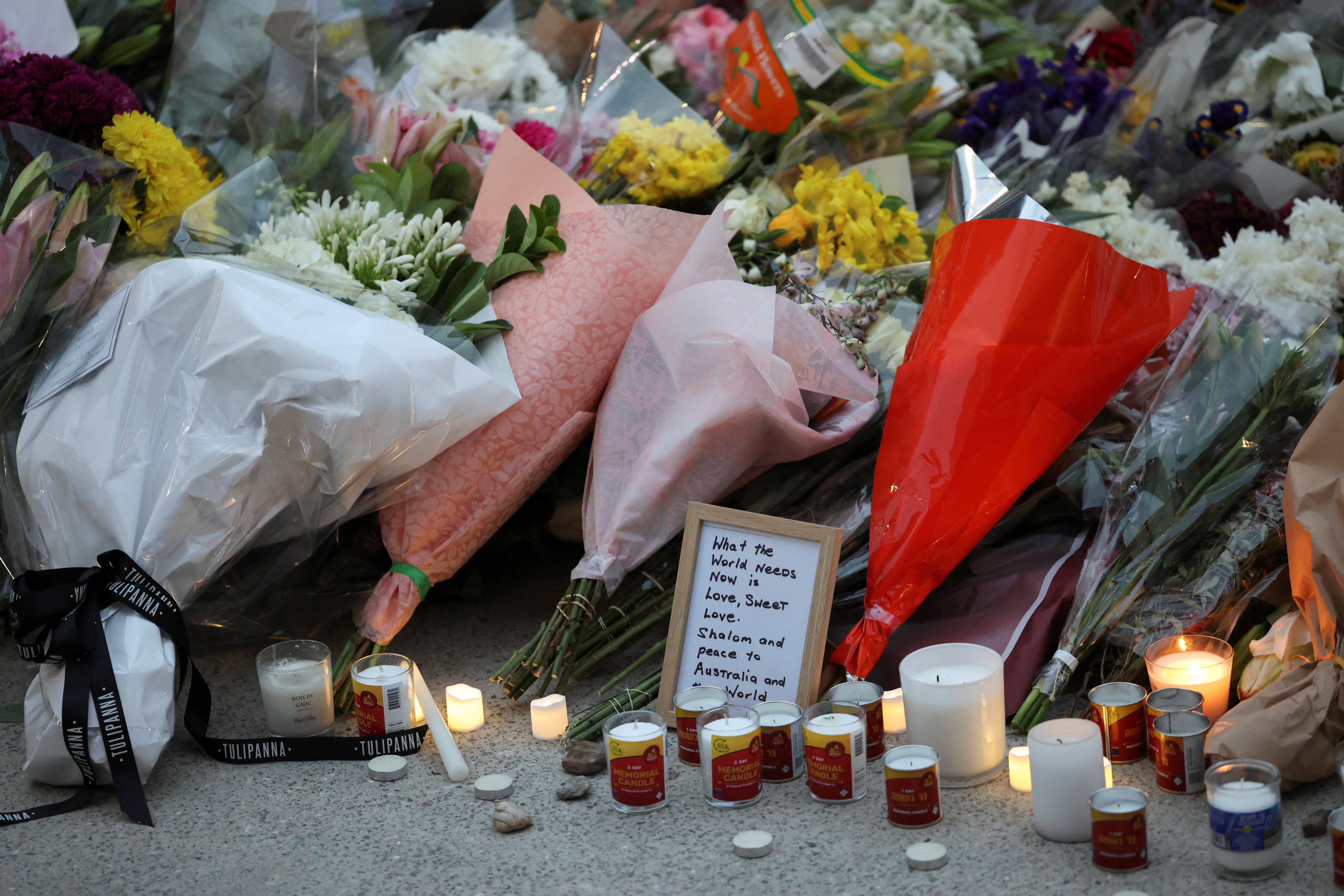 People pay respects at Bondi Pavilion to victims of a shooting during a Jewish holiday celebration at Bondi Beach, in Sydney