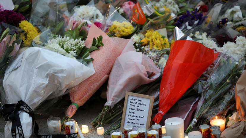 People pay respects at Bondi Pavilion to victims of a shooting during a Jewish holiday celebration at Bondi Beach, in Sydney
