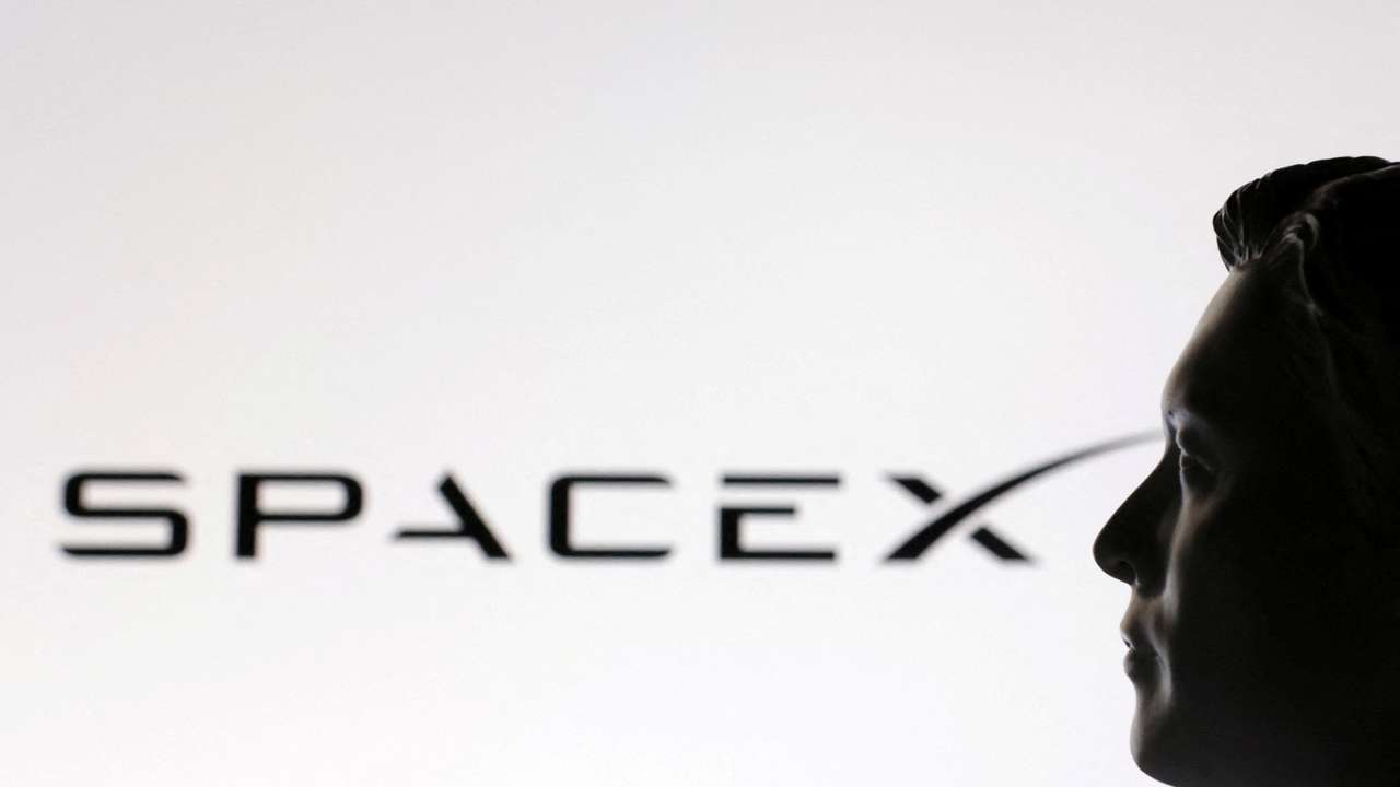 FILE PHOTO: Illustration shows 3D-printed miniature model of Elon Musk and SpaceX logo