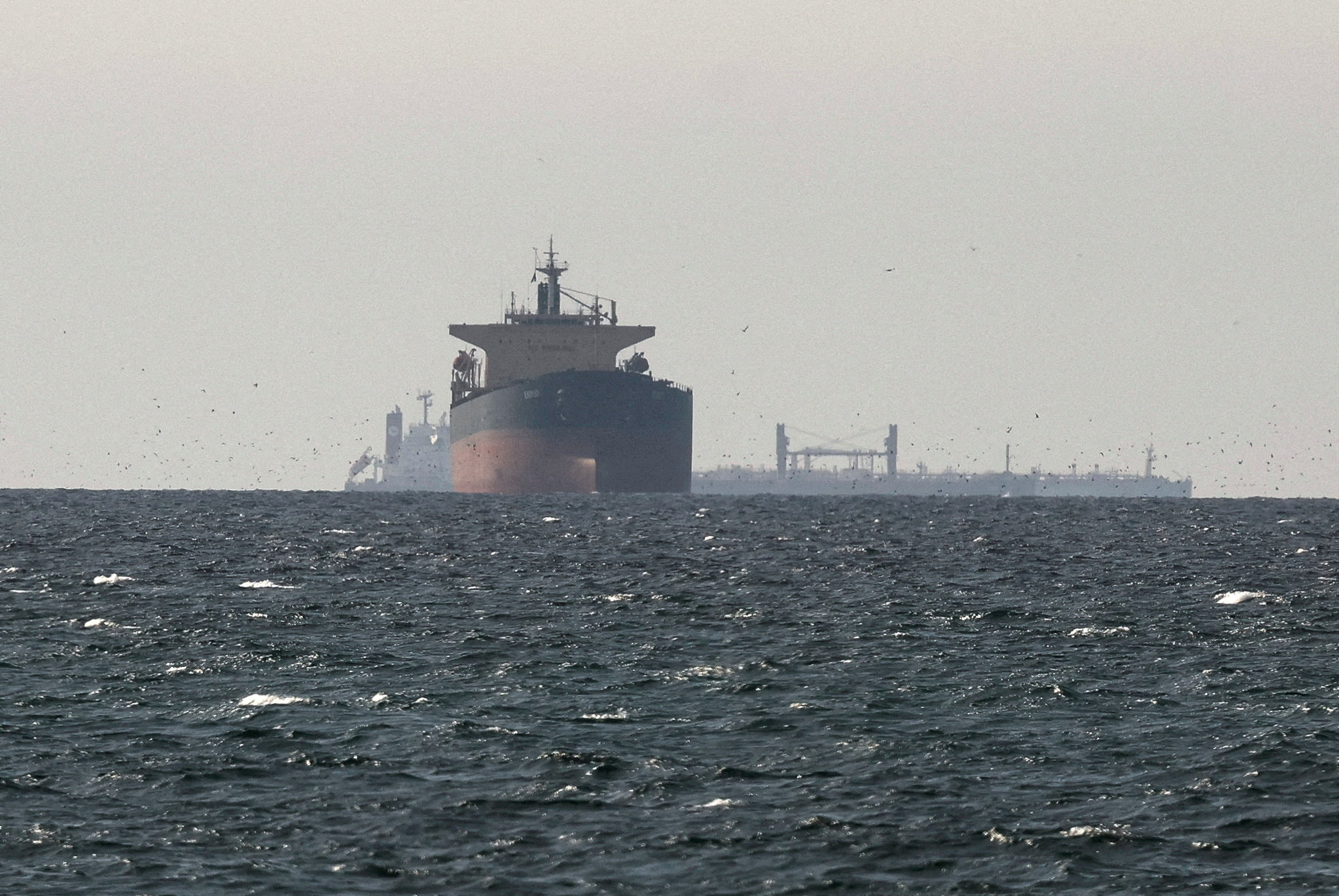 FILE PHOTO: Tankers sail in the Gulf, near the Strait of Hormuz