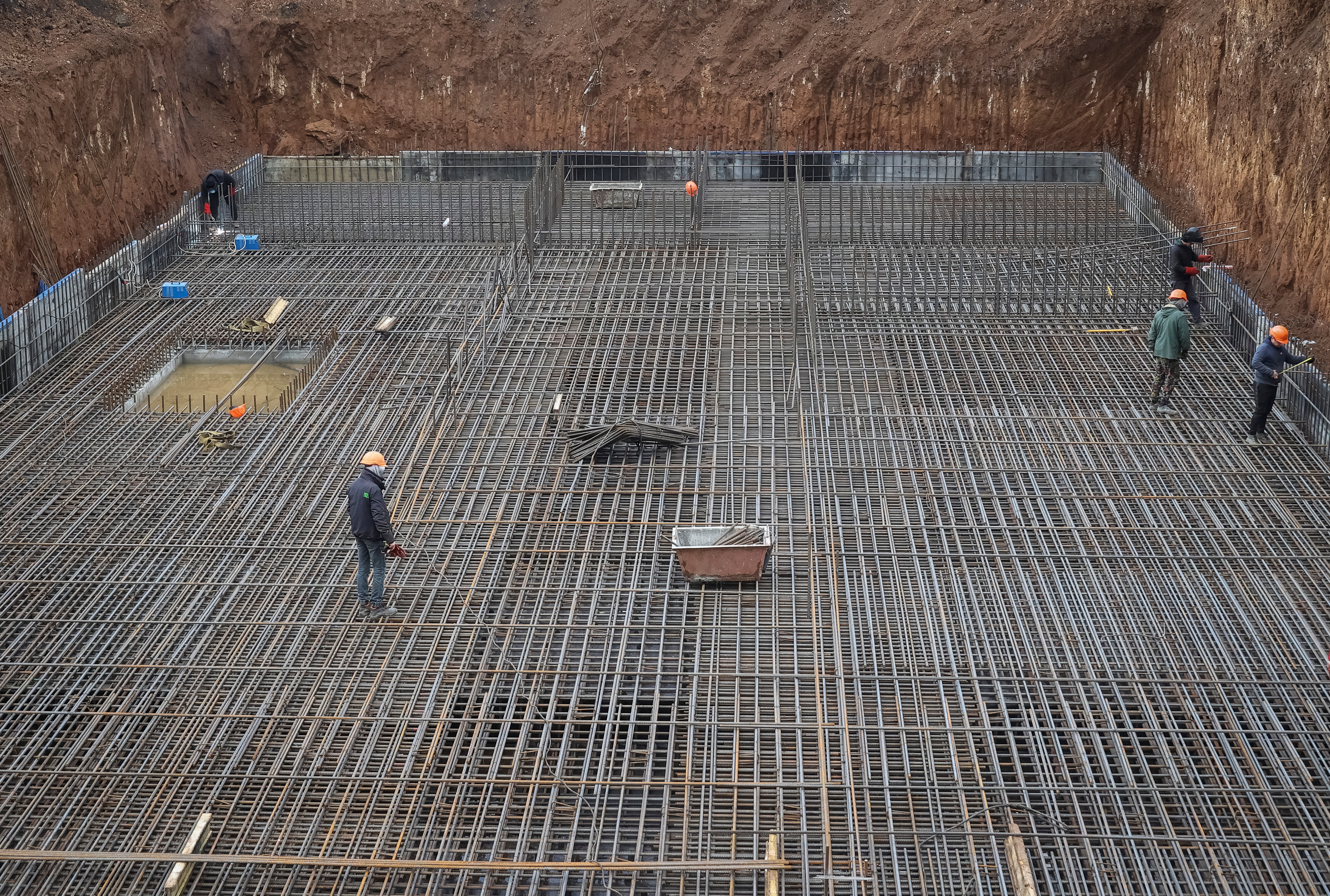 Workers build a heavily fortified underground school that will allow children to safely return to in-person studies in Kharkiv region