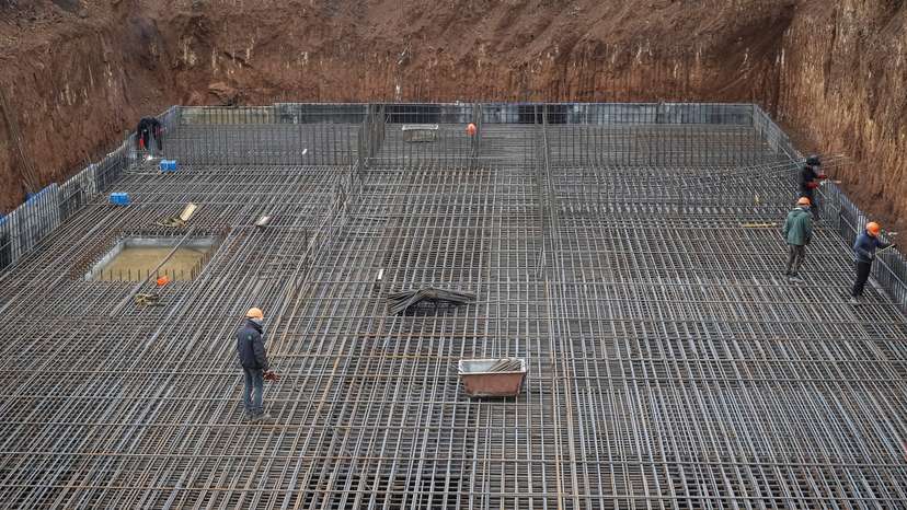 Workers build a heavily fortified underground school that will allow children to safely return to in-person studies in Kharkiv region