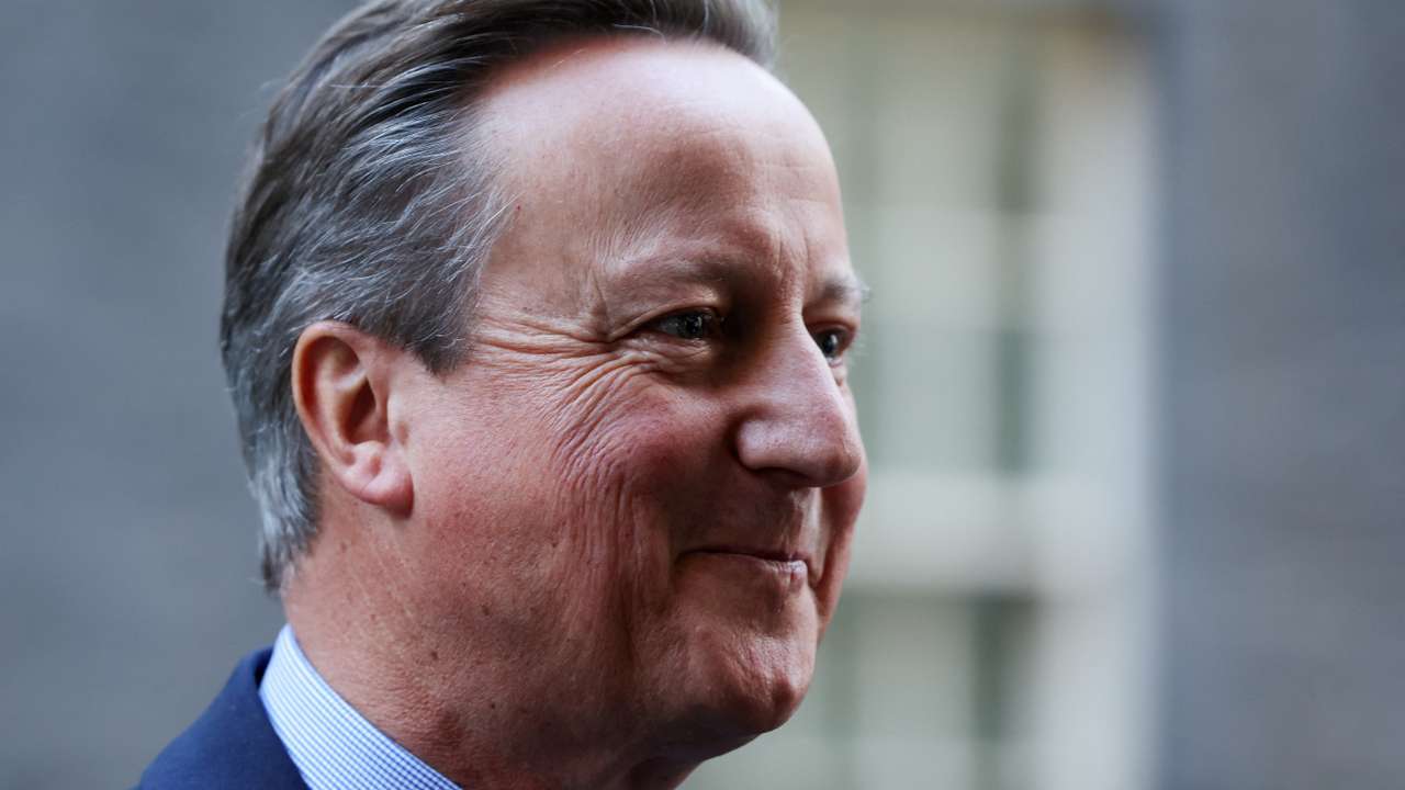 Britain's former Prime Minister and newly appointed Foreign Secretary David Cameron reacts outside 10 Downing Street in London