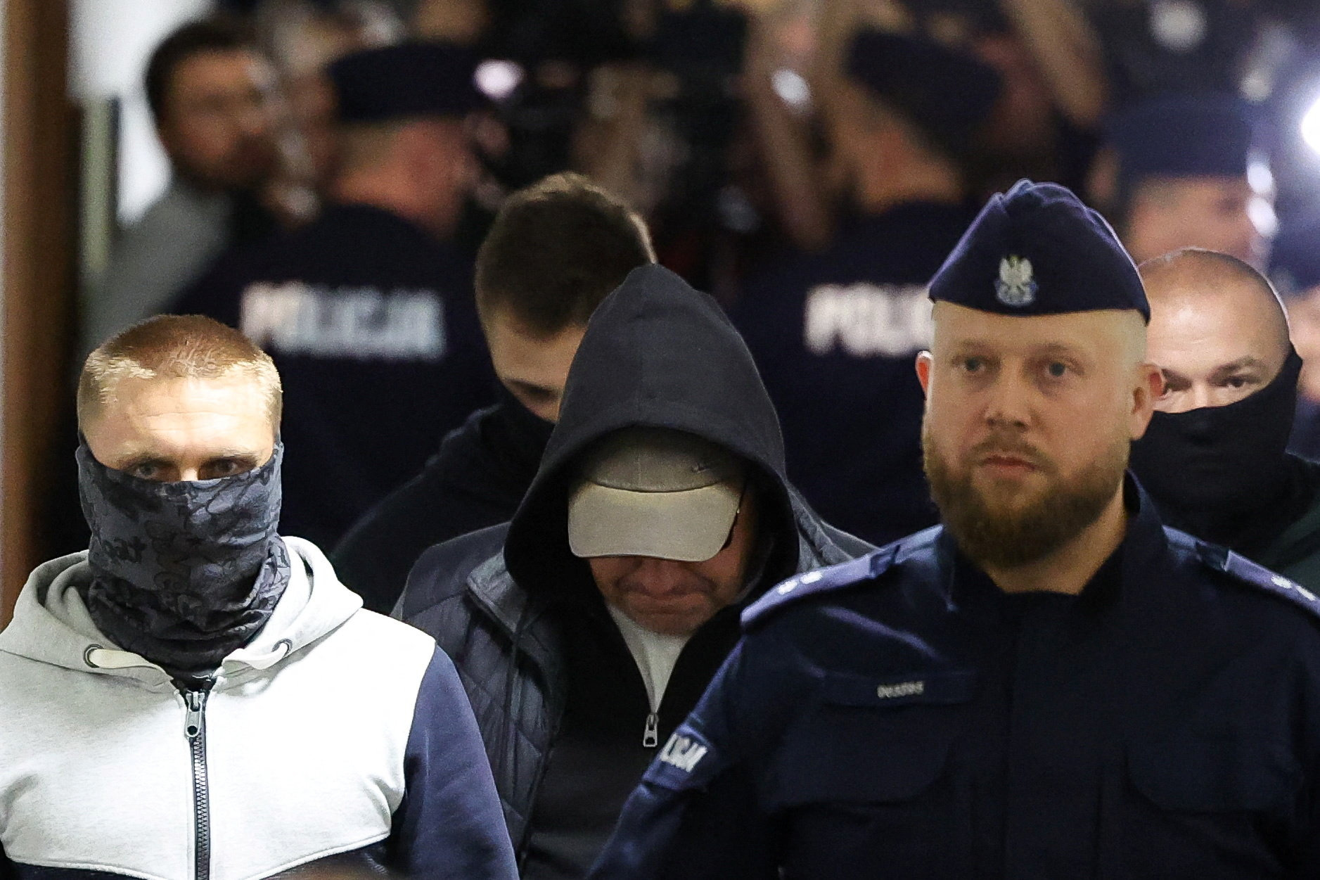 A Ukrainian diver, Volodymyr Z., wanted by Germany over his alleged involvement in the 2022 explosions that damaged the Nord Stream pipeline, walks escorted by Polish Police at the district court