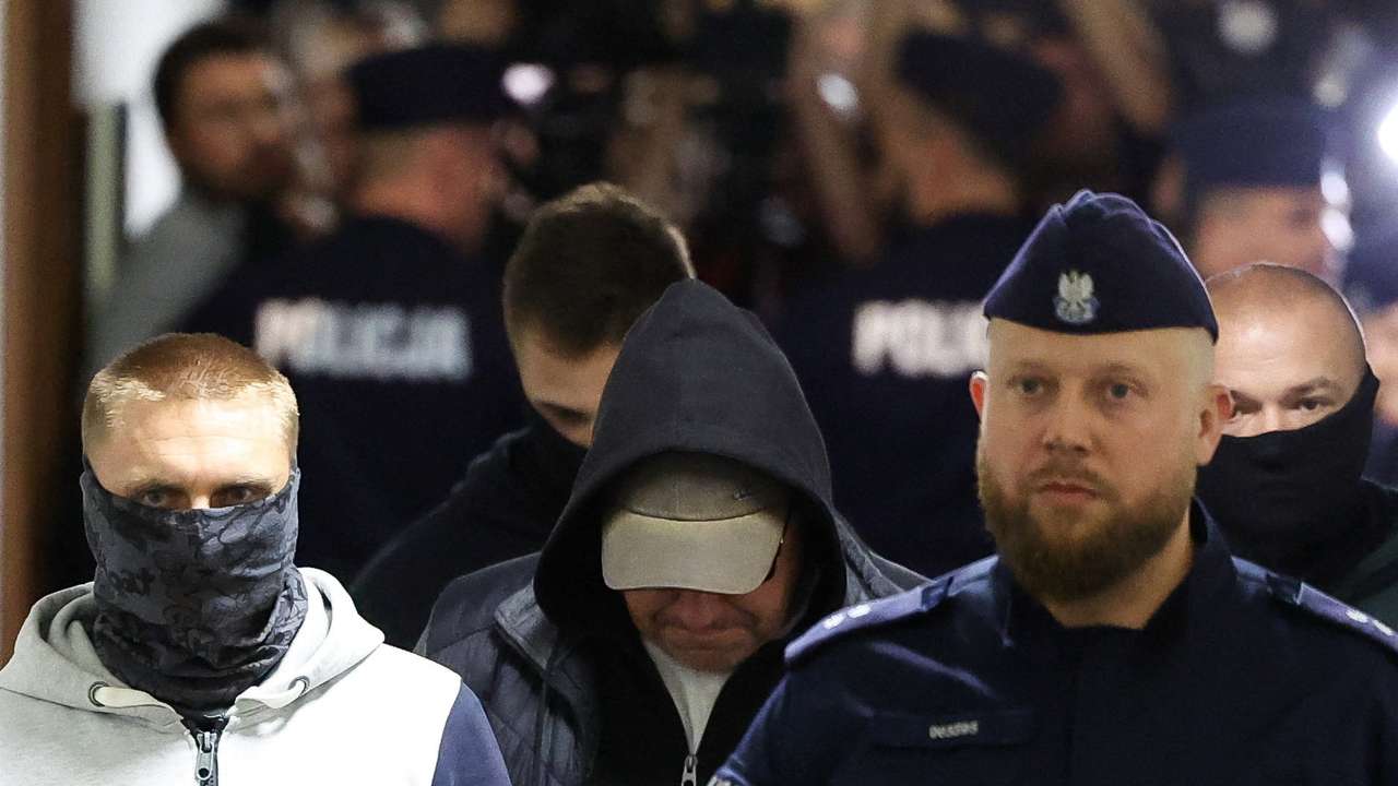 A Ukrainian diver, Volodymyr Z., wanted by Germany over his alleged involvement in the 2022 explosions that damaged the Nord Stream pipeline, walks escorted by Polish Police at the district court