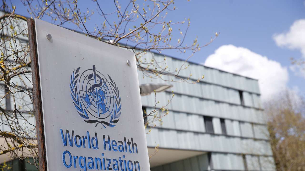 A logo is pictured outside a building of the WHO in Geneva