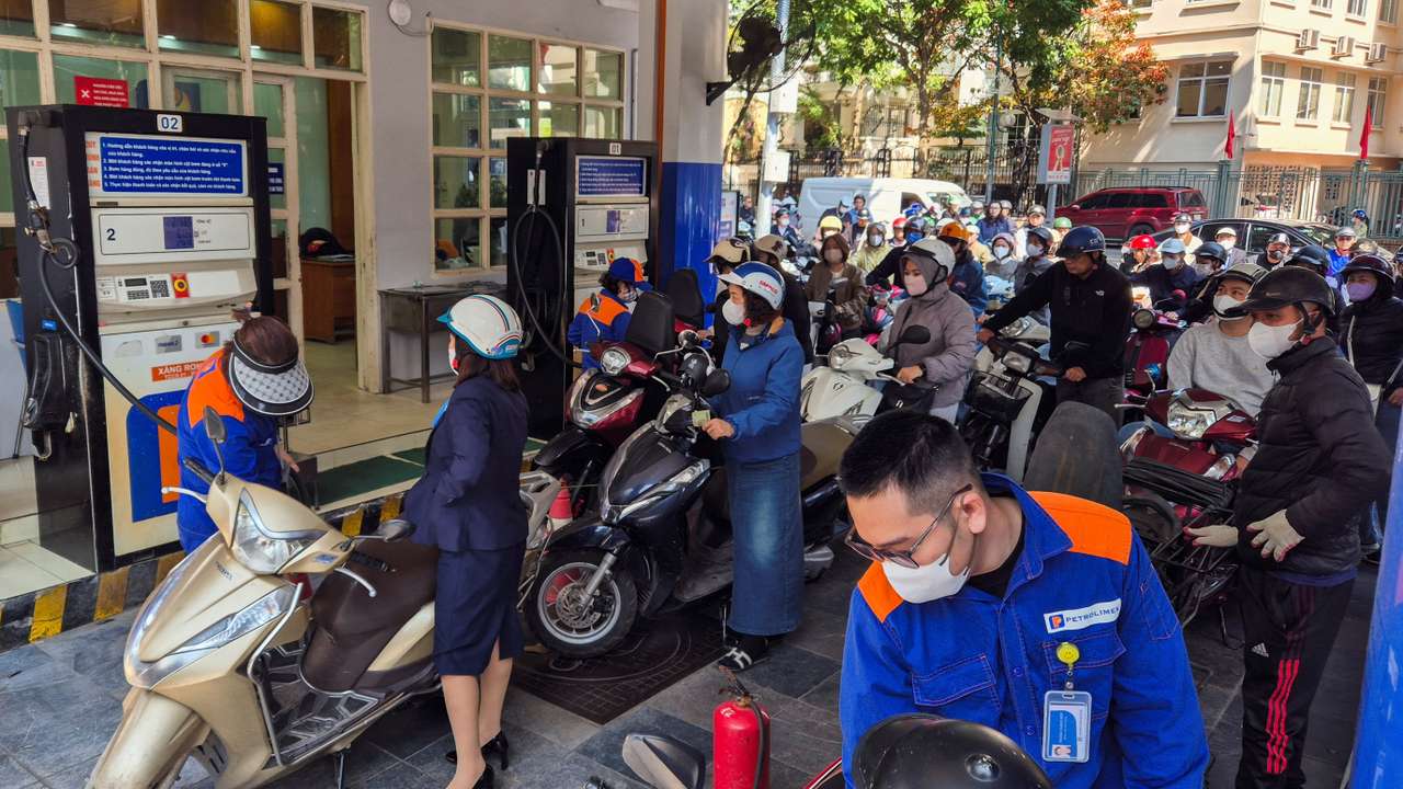 People queue to buy petrol at a petrol station after Vietnam's trade ministry called on local businesses to encourage their employees to work from home, amid the U.S.-Israeli conflict with Iran, in Hanoi