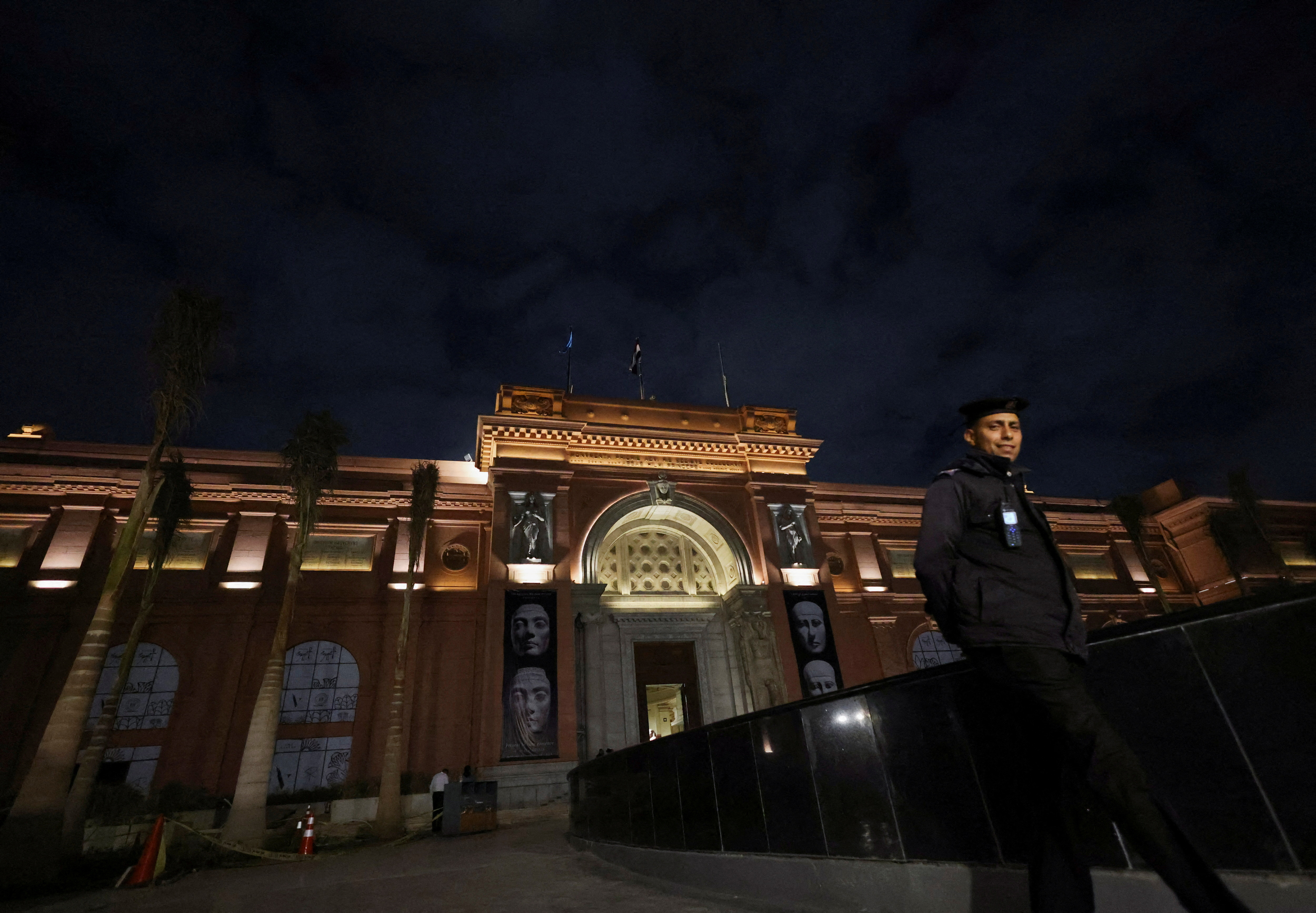 FILE PHOTO: A police officer walks next to an entrance of the Egyptian Museum  in Egypt's capital of Cairo