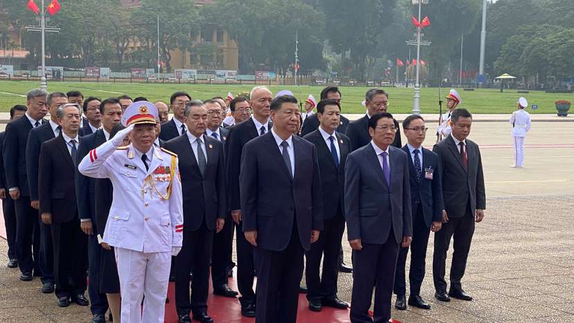 Chinese President Xi Jinping attends a lay wreath ceremony at the Ho Chi Minh mausoleum during a two day state visit to Hanoi