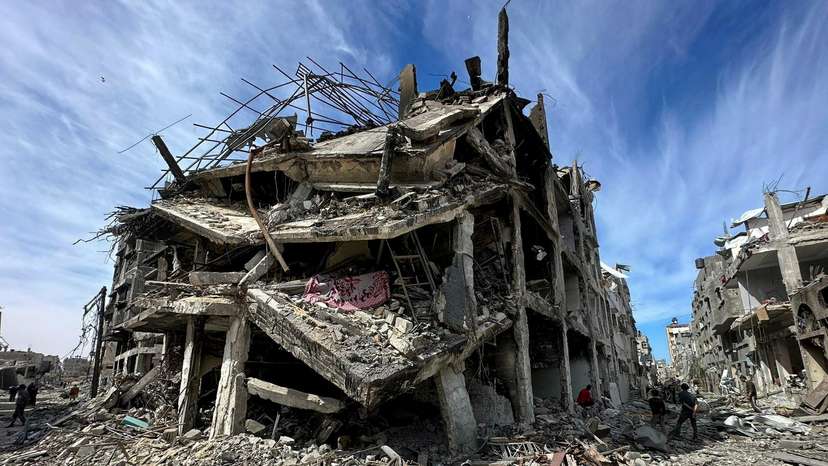 FILE PHOTO: Residents inspect damages caused to Zeitoun neighborhood, in Gaza City