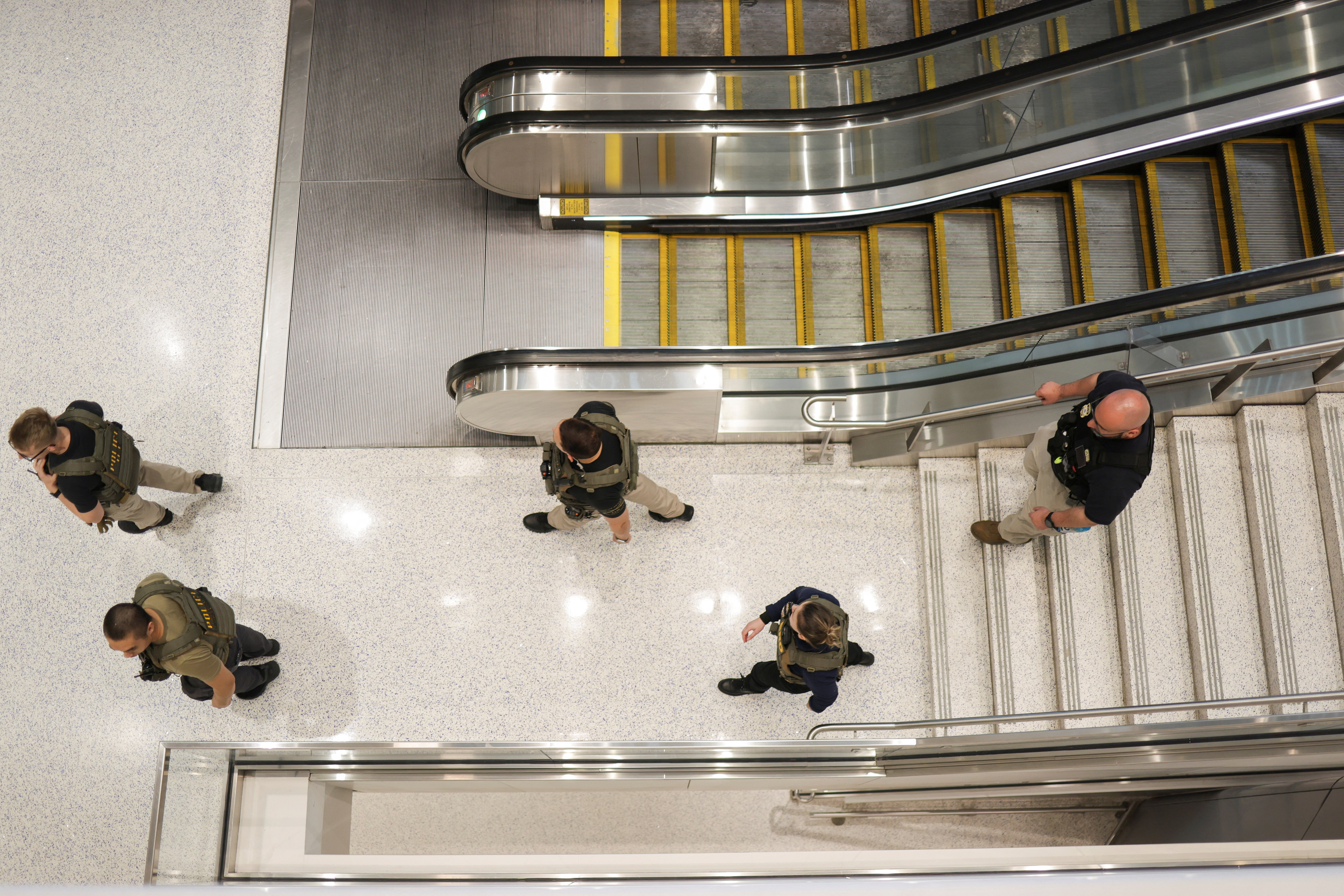 Immigration and Customs Enforcement agents walk at Newark Liberty International Airport