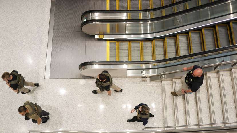 Immigration and Customs Enforcement agents walk at Newark Liberty International Airport