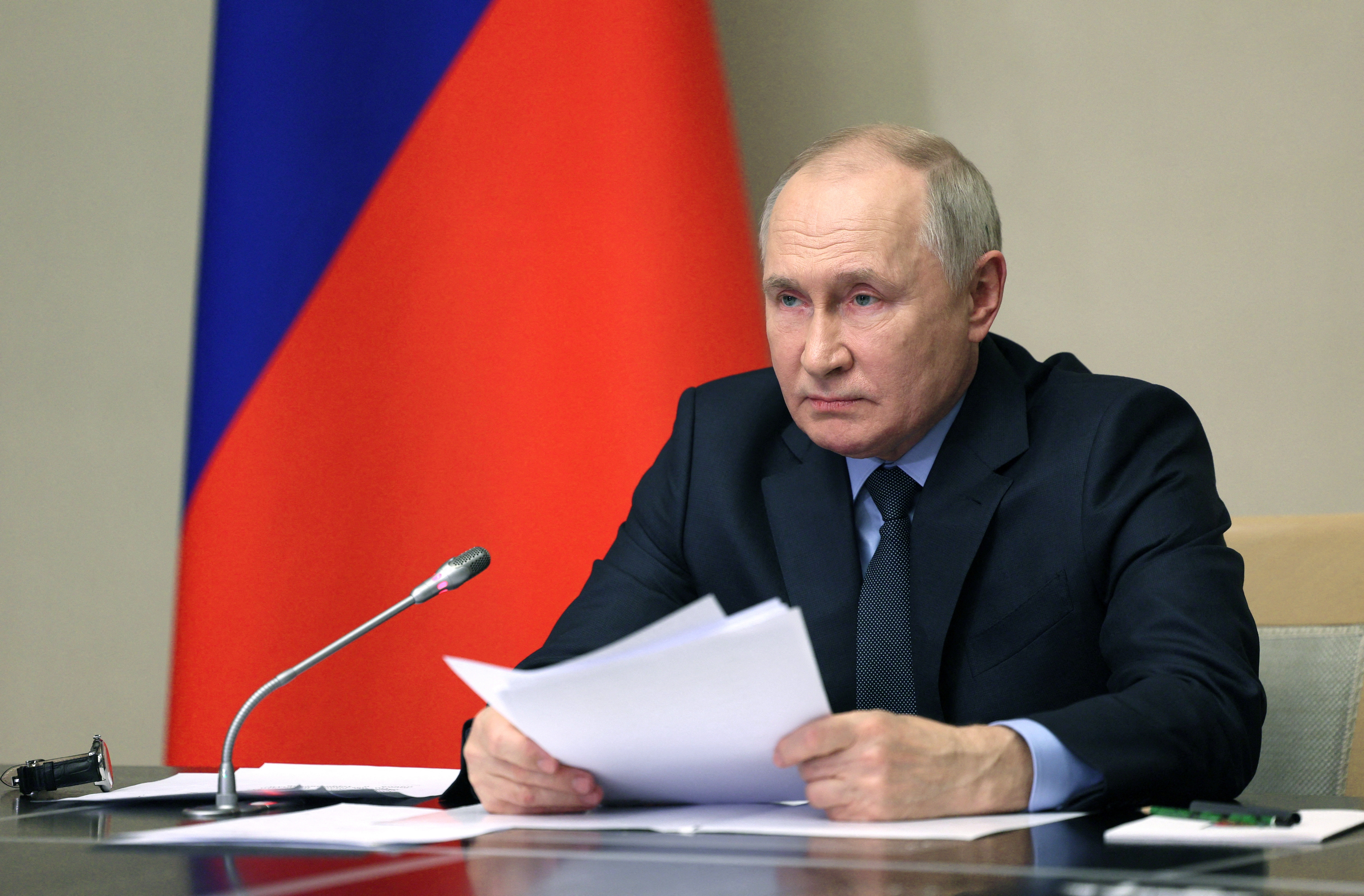 Russian President Vladimir Putin chairs a meeting of members of his Security Council and the government and the heads of law enforcement agencies, outside Moscow