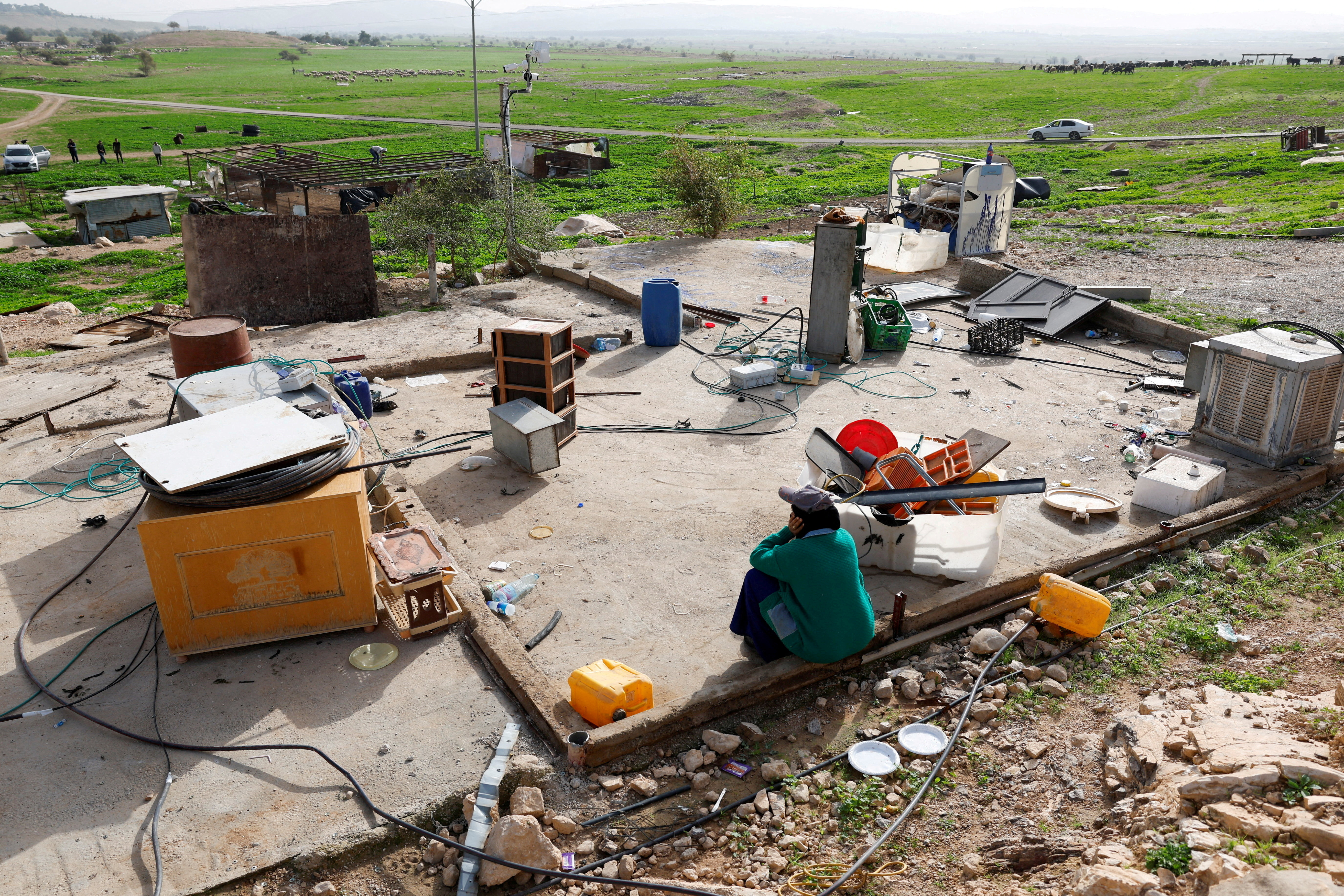 FILE PHOTO: Members of a Palestinian Bedouin community leave following Israeli settler violence