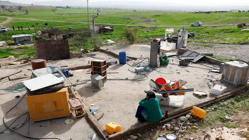 FILE PHOTO: Members of a Palestinian Bedouin community leave following Israeli settler violence