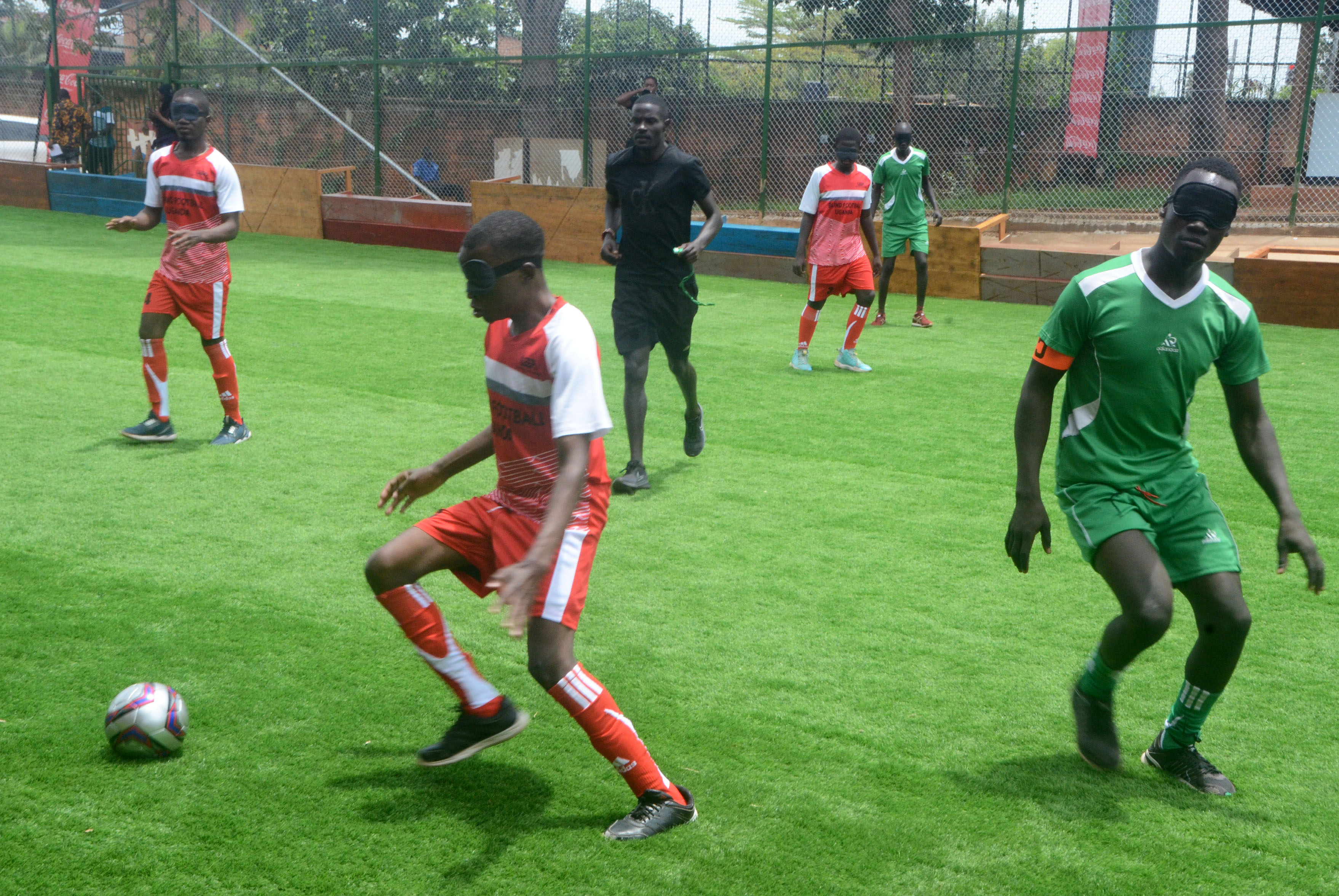 blind football players compete