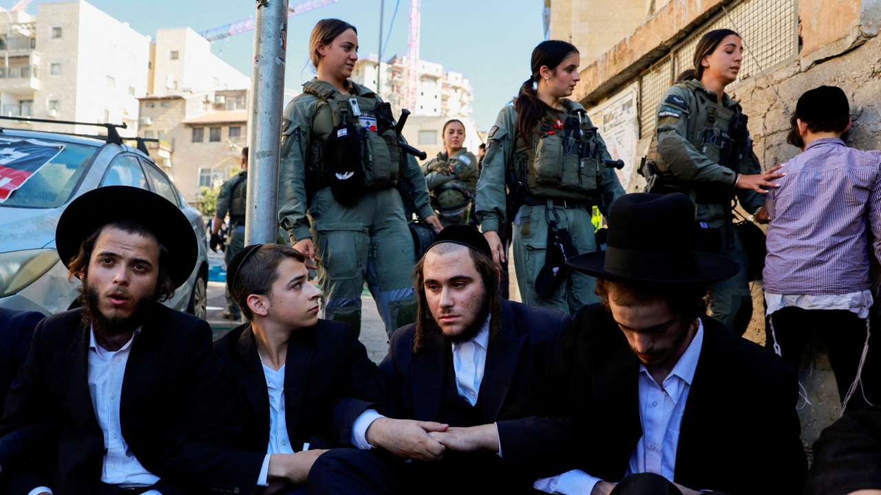 FILE PHOTO: Ultra-Orthodox Jewish men protest against attempts to recruit men from the community, in Jerusalem