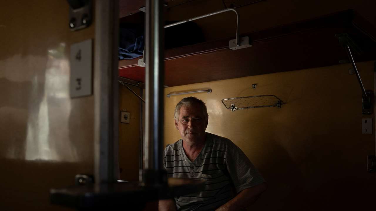 Volodymyr Arkhipov, who fled Russian advances towards his hometown of Toretsk, sits in an evacuation train in Pokrovsk