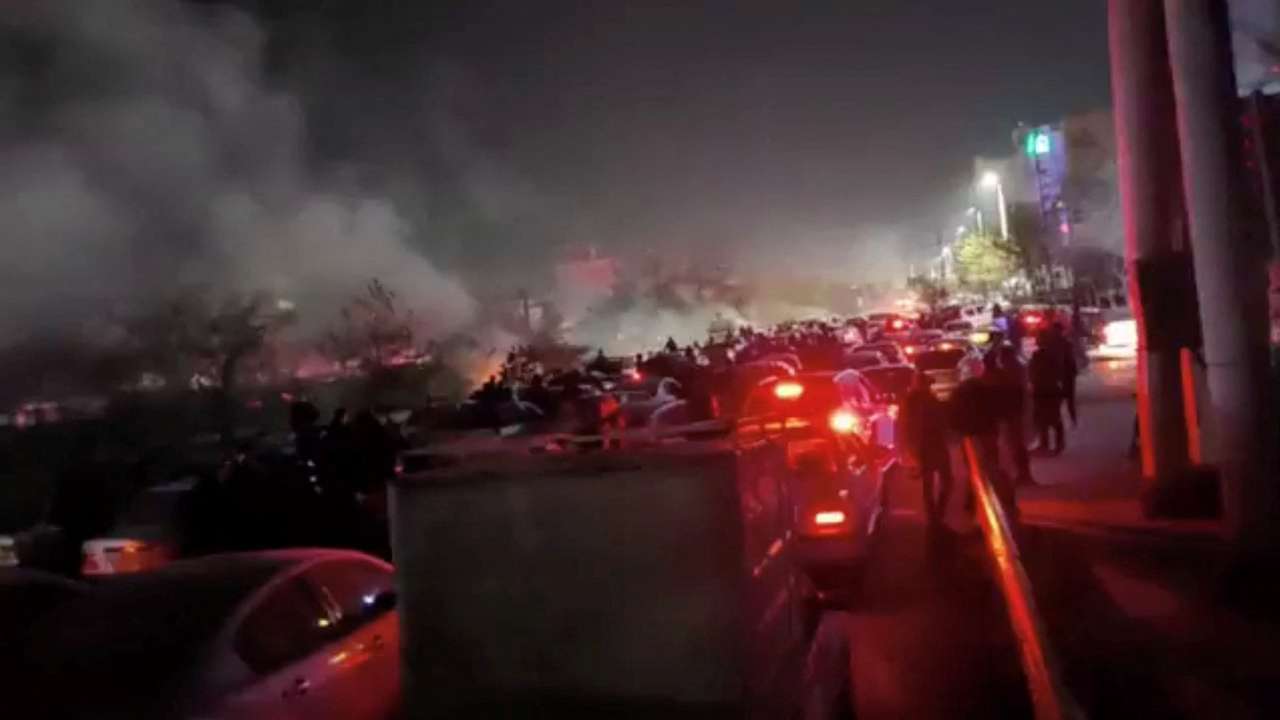 Smoke rises as protesters gather amid evolving anti-government unrest in Mashhad