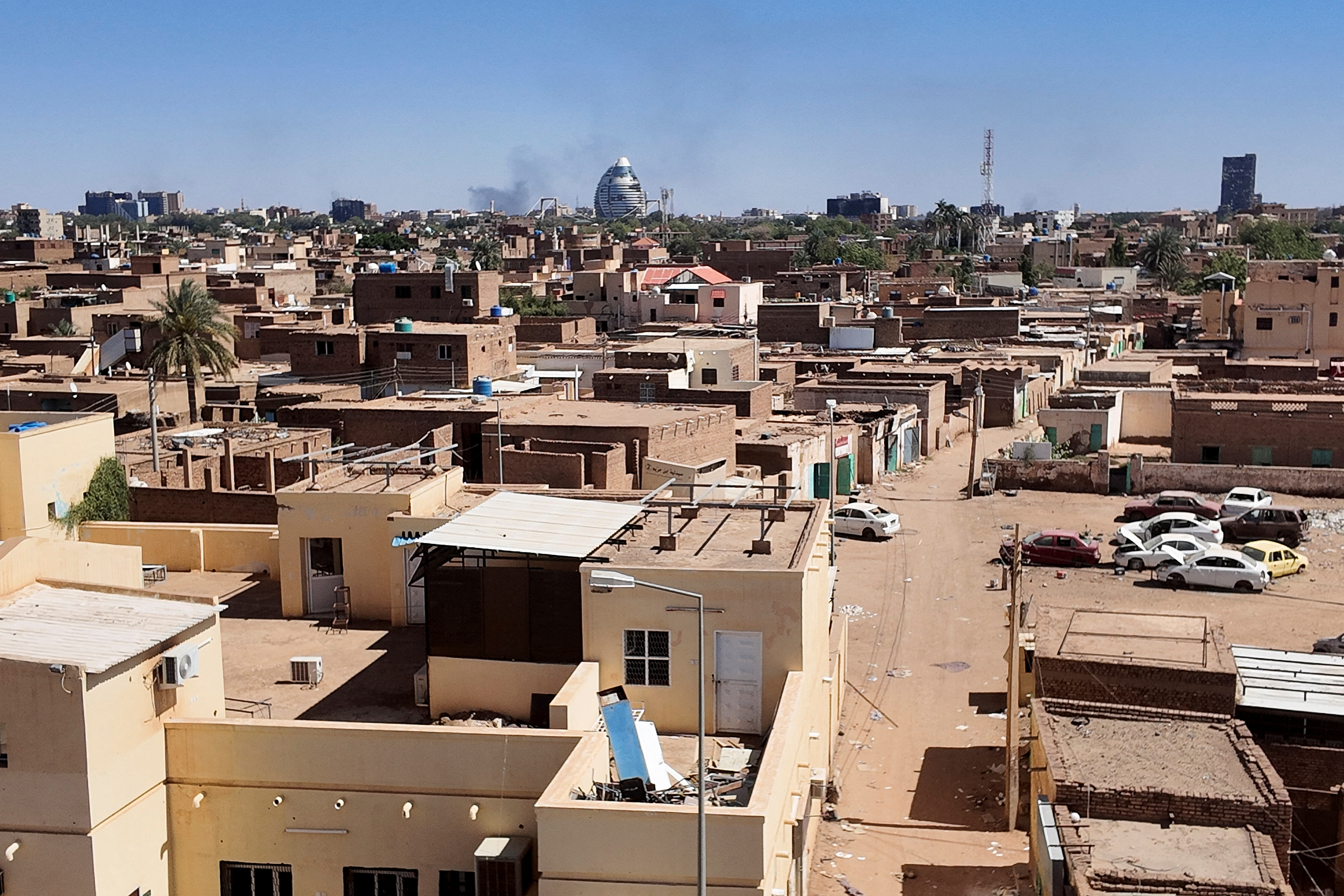 A general view of smoke rising over houses in Tuti Island