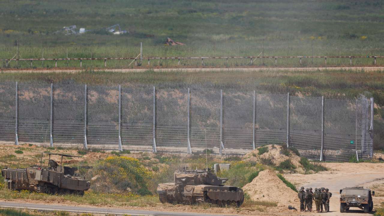 Israeli military vehicles hold position near the Israel-Gaza border