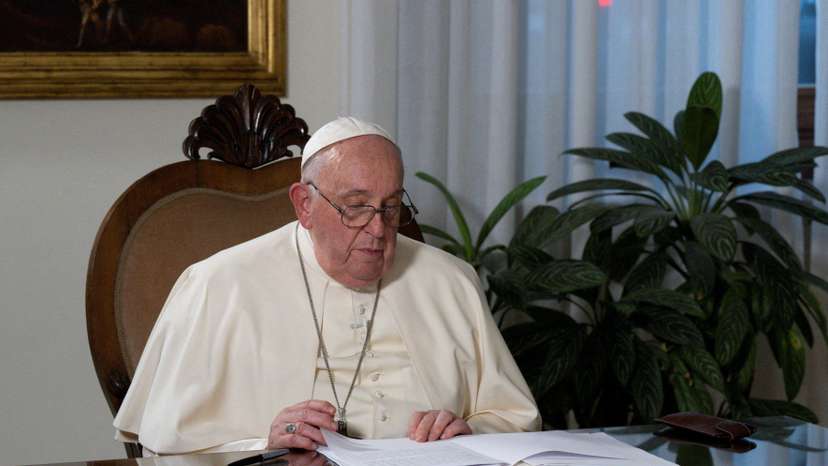 FILE PHOTO: Pope Francis signs a unified faith declaration on climate action as part of the inauguration of the "Faith Pavilion" during COP28 in Dubai, at Casa Santa Marta