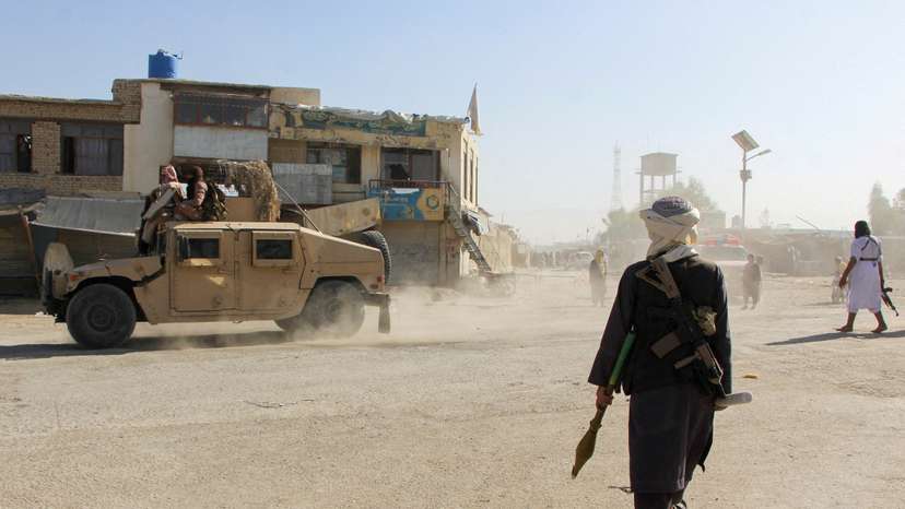 FILE PHOTO: Afghan Taliban fighters patrol near the Afghanistan-Pakistan border in Spin Boldak, Kandahar Province, following exchanges of fire between Pakistani and Afghan forces
