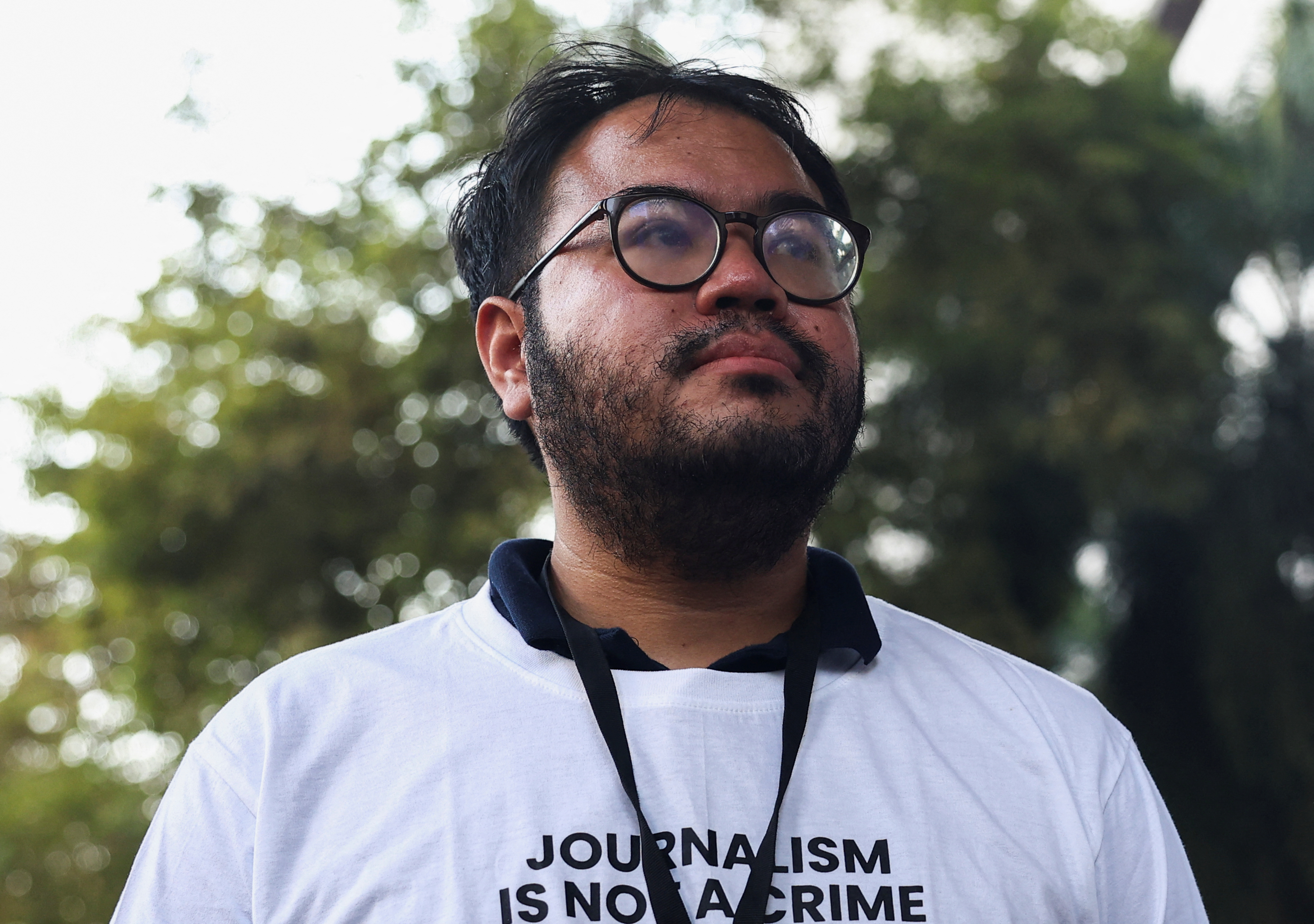 Nattaphol Meksobhon reacts post receiving bail after his arrest for his news coverage last March, in Bangkok