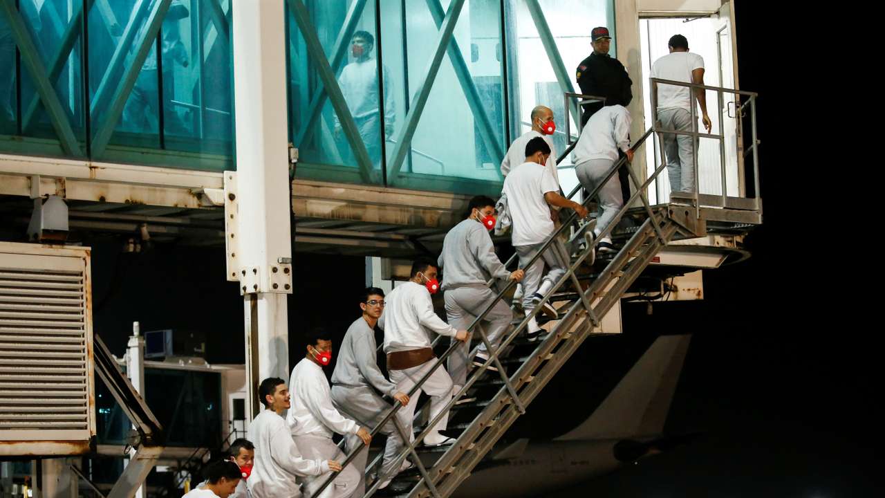 Venezuelan migrants flown home from Guantanamo Bay via Honduras, arrive on a deportation flight at Simon Bolivar International Airport in Maiquetia