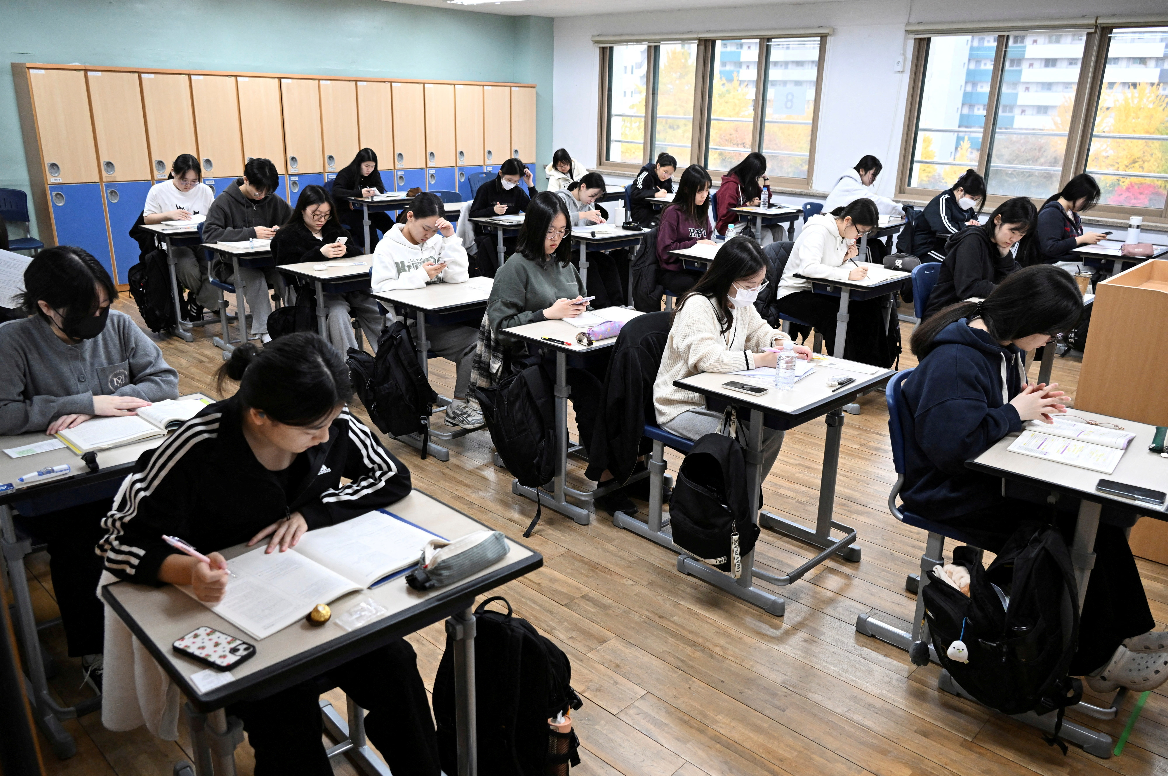 FILE PHOTO: South Korean students wait to take the annual College Scholastic Ability Test at a school in Seoul