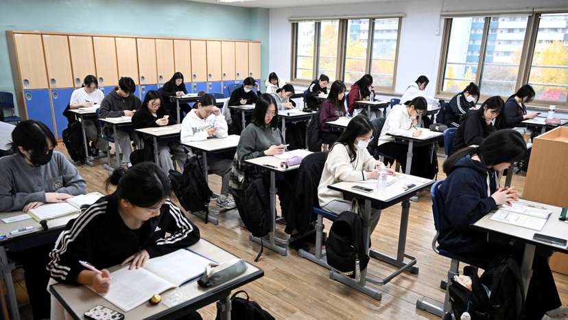FILE PHOTO: South Korean students wait to take the annual College Scholastic Ability Test at a school in Seoul