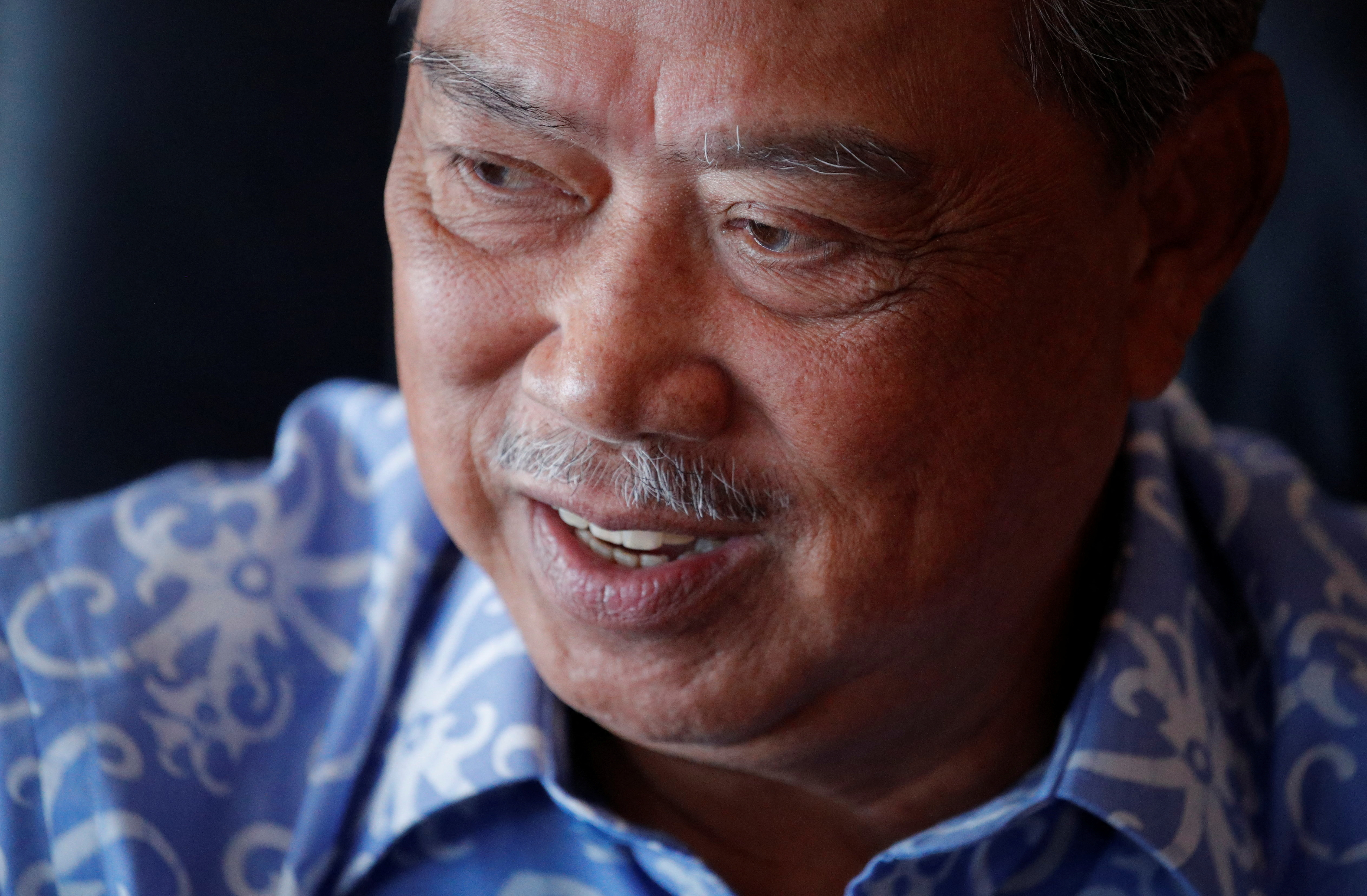 FILE PHOTO: Malaysian opposition leader and former premier Muhyiddin Yassin speaks during an interview at Kuala Lumpur