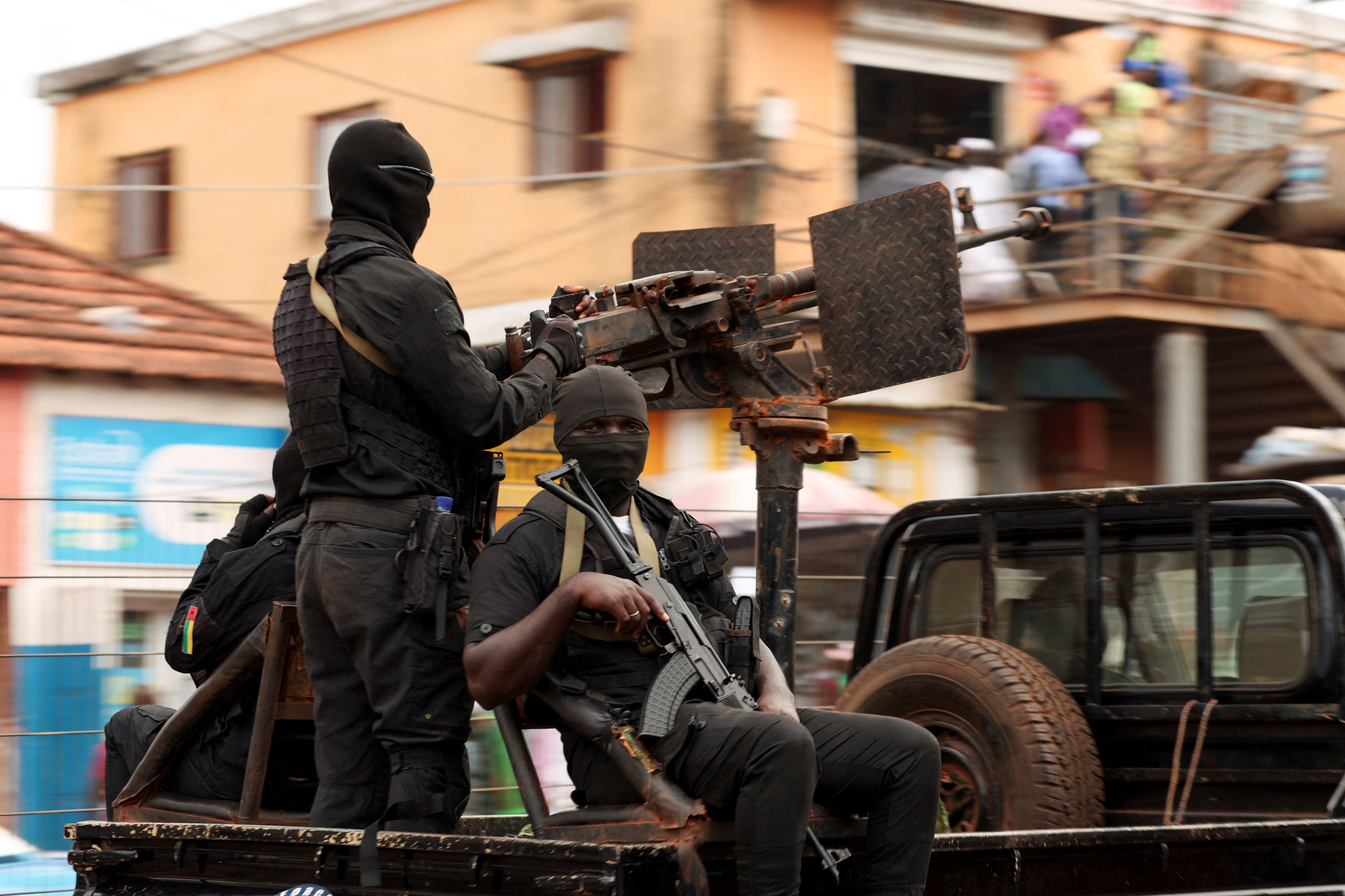 Soldiers patrol on the main road in Bissau