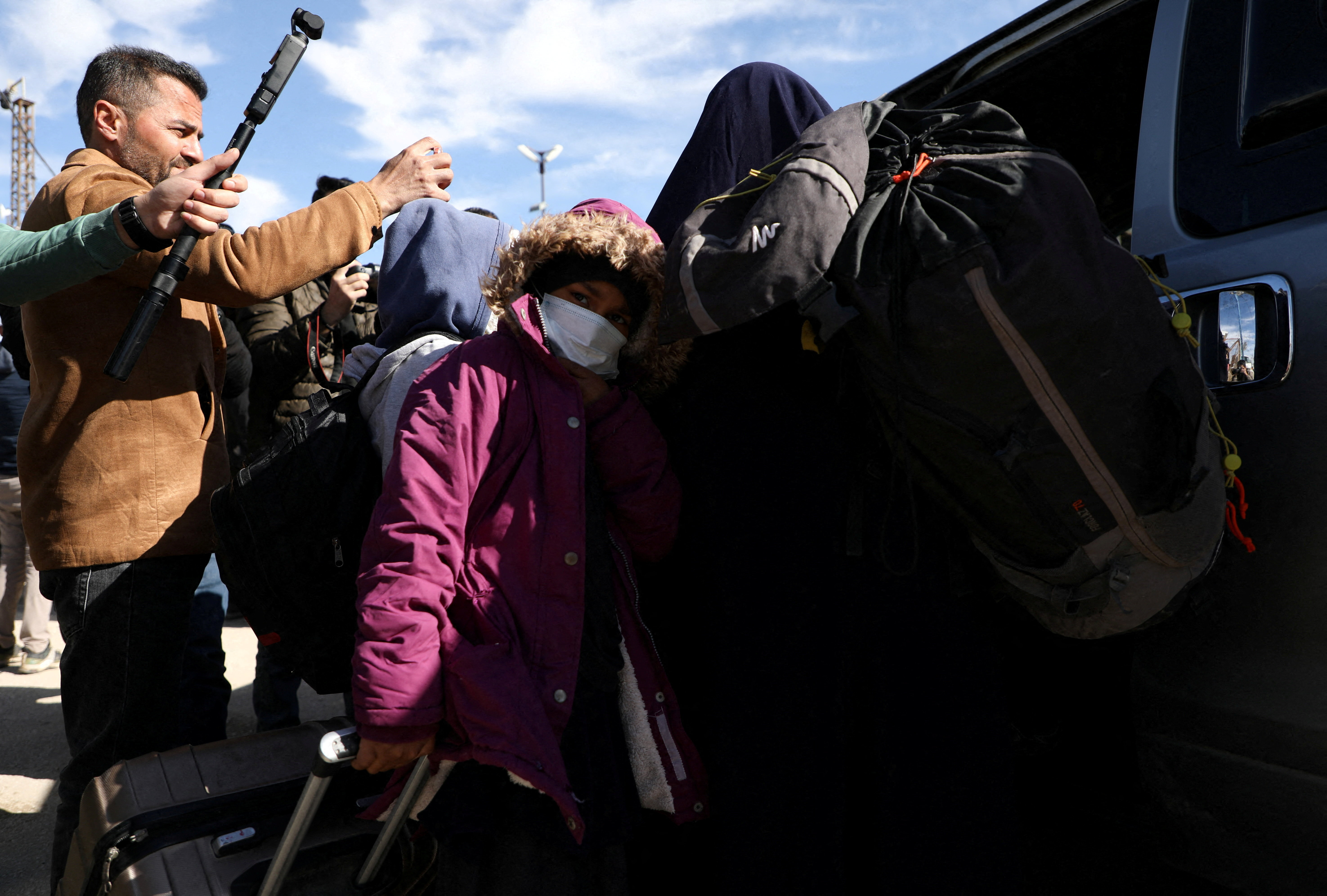 Australian families believed to be linked to the Islamic State militants leave Roj camp near Derik