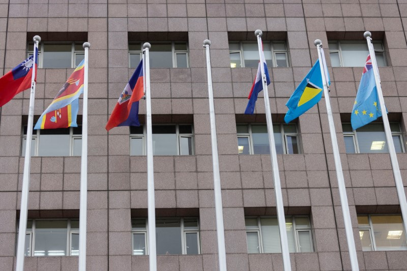 An empty flag pole where Nauru's flag used to fly is pictured next to flags of other countries at the Diplomatic Quarter which houses embassies in Taipei