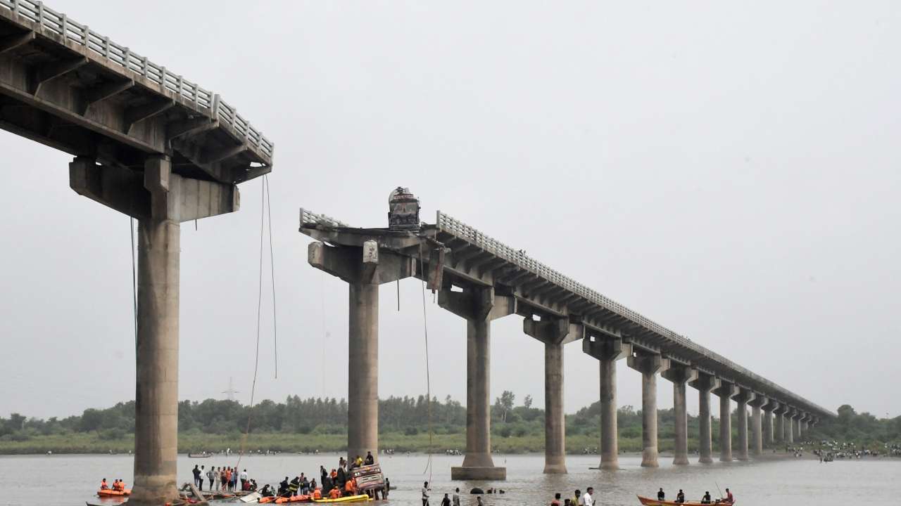 Rescuers search for survivors after a bridge collapsed in Vadodara