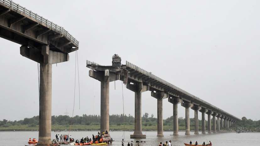 Rescuers search for survivors after a bridge collapsed in Vadodara