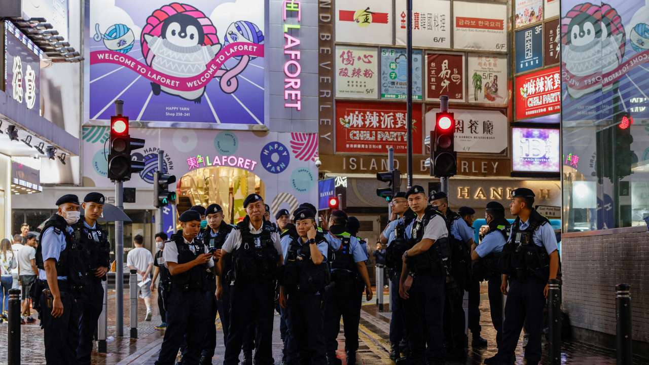 Police stand guard at Causeway Bay, in Hong Kong