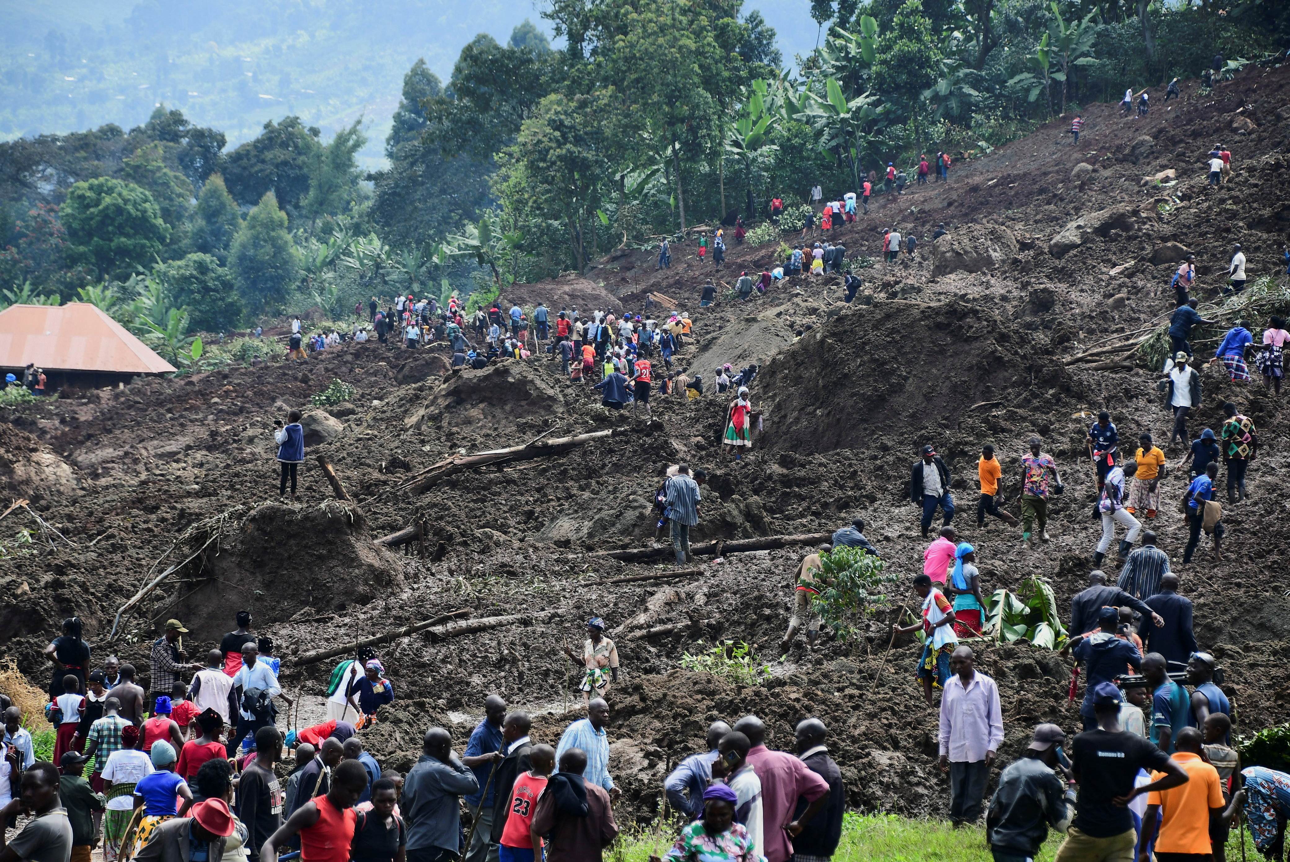 Ugandan villagers search for those buried by deadly mudslide