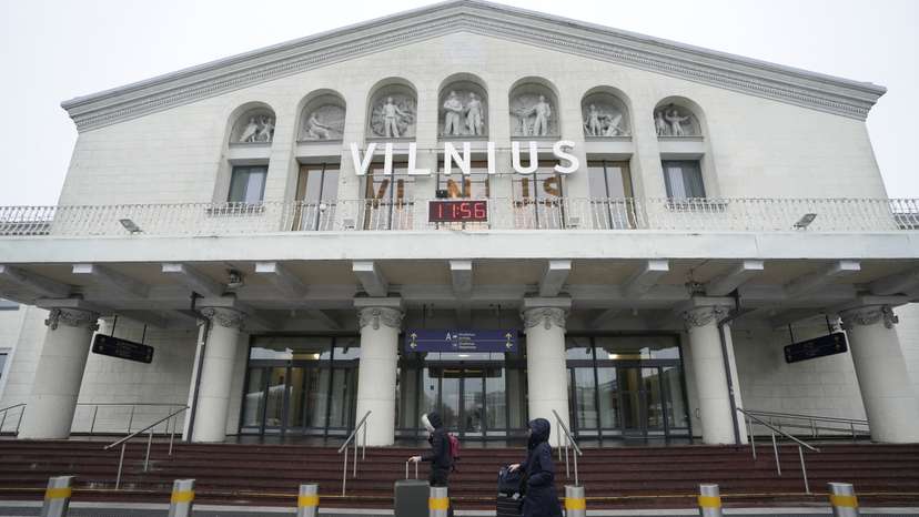 Passengers walk past the arrival terminal in Vilnius Ciurlionis International Airport in Vilnius