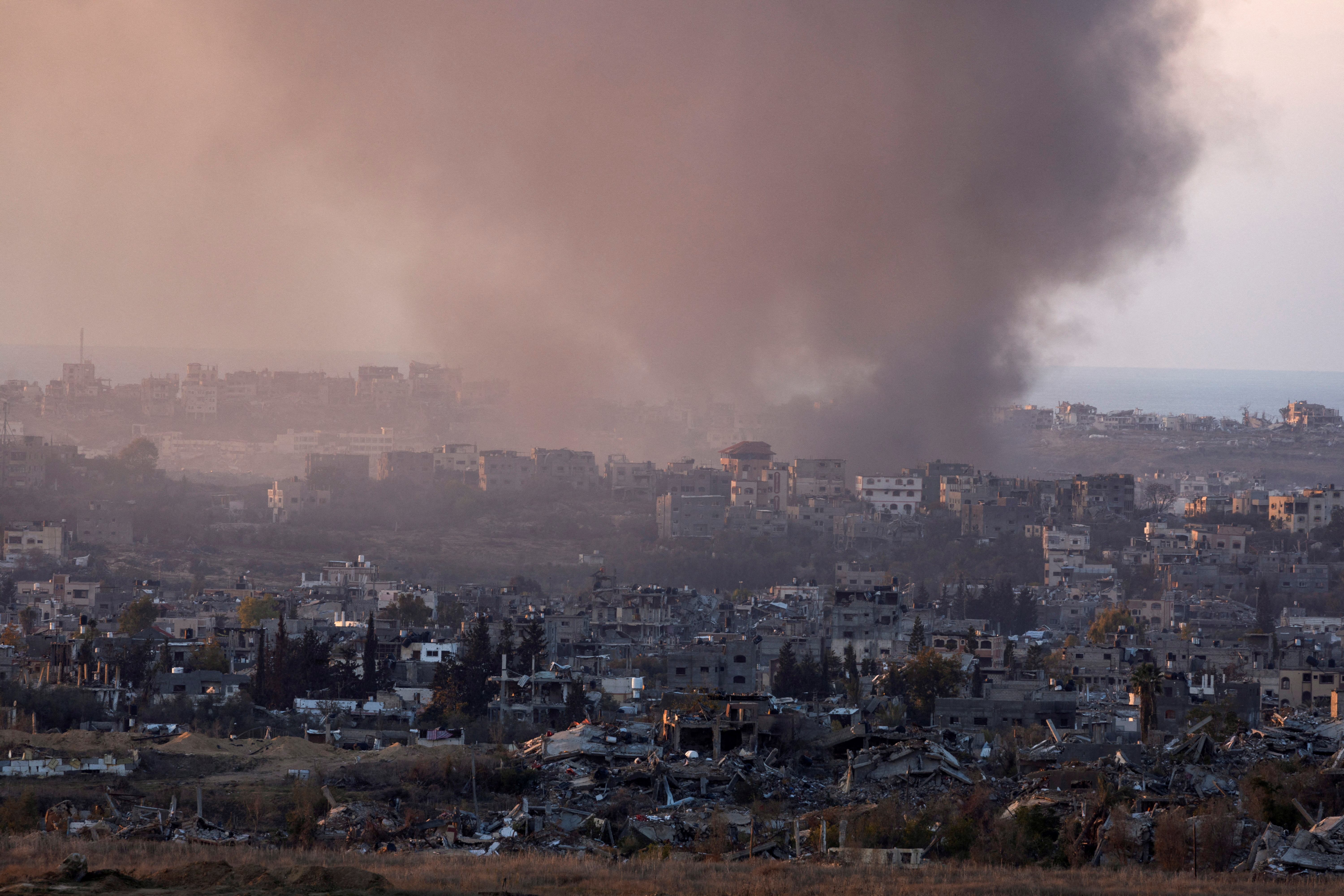 FILE PHOTO: Smoke rises from Gaza, as seen from the Israeli side of the border