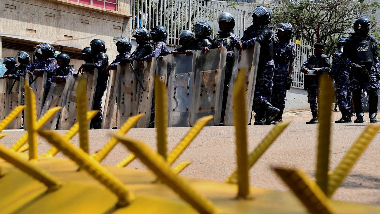 FILE PHOTO: Ugandan security forces detain young protesters marching in Kampala