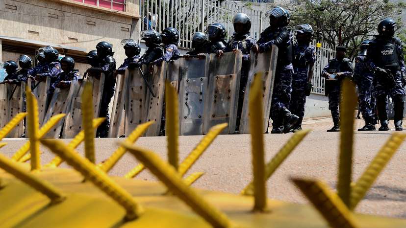 FILE PHOTO: Ugandan security forces detain young protesters marching in Kampala