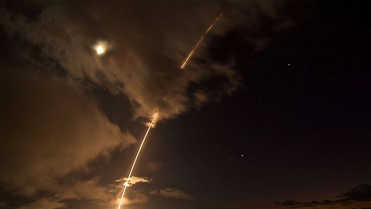 FILE PHOTO: FILE PHOTO: A medium-range ballistic missile target is launched from the Pacific Missile Range Facility, before being successfully intercepted by Standard Missile-6 missiles fired from the guided-missile destroyer USS John Paul Jones, in Kauai